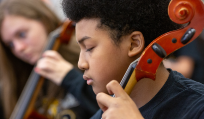 Two students passionately play violins.